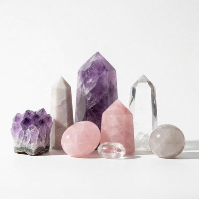 Assortment of healing crystals on a clean white background
